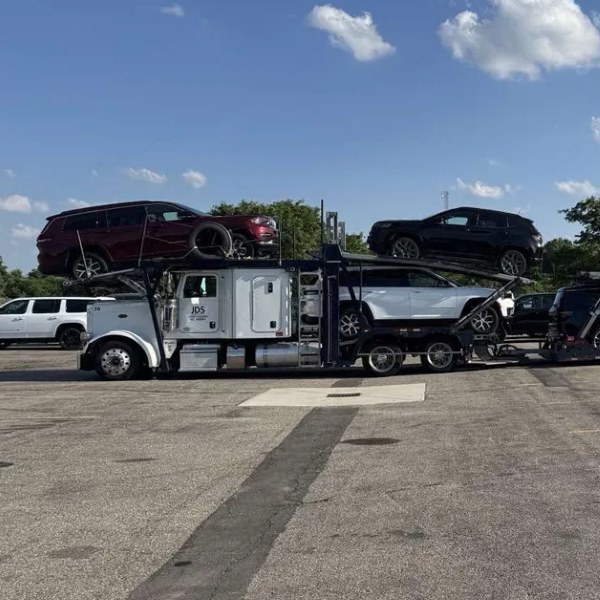 A fully loaded JDS open car carrier
